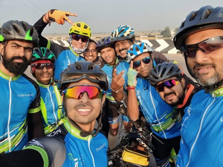 BCR cycling friends in helmets and blue jerseys